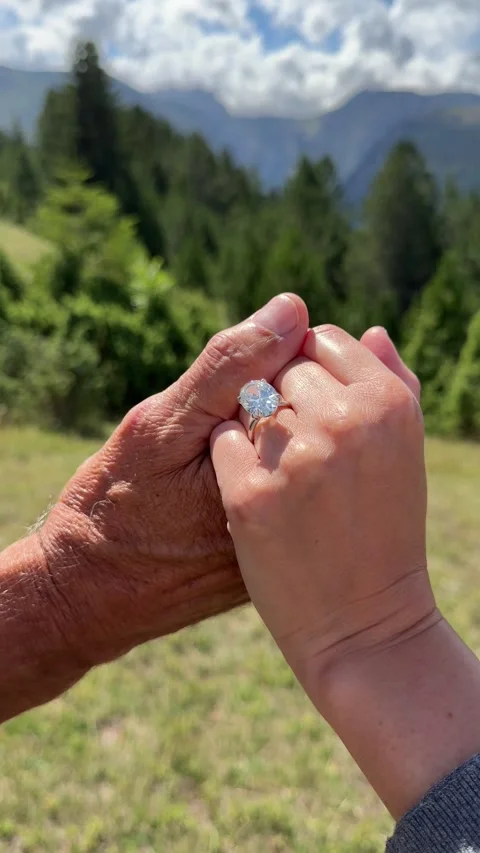 Vertical romantic couple scene with oval diamond engagement ring Montenegro Stock Footage 319450017