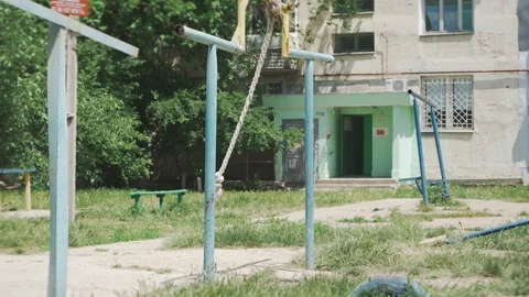 Vertical rope swinging in a large yard Stock Footage 109391694