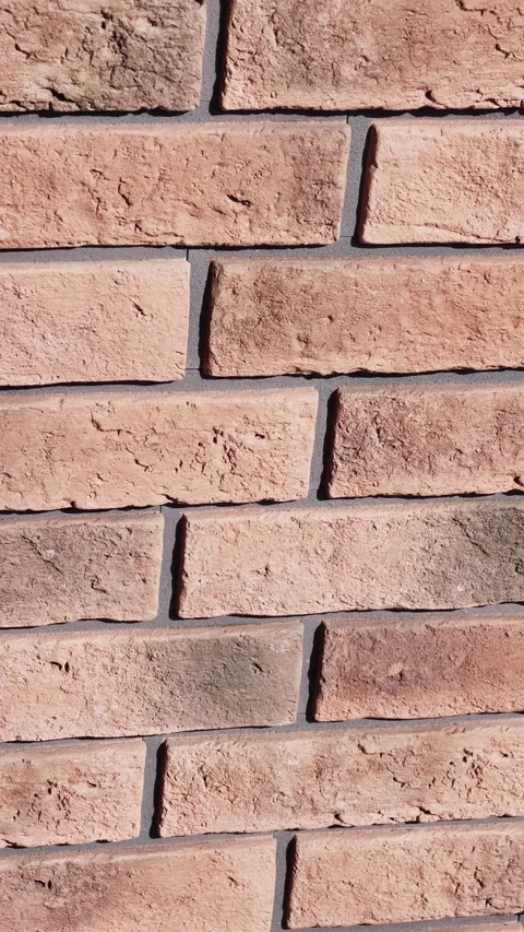 Vertical Rotating Brick Wall Texture Clockwise 4K Slow Motion HDR Stock Footage 333696606
