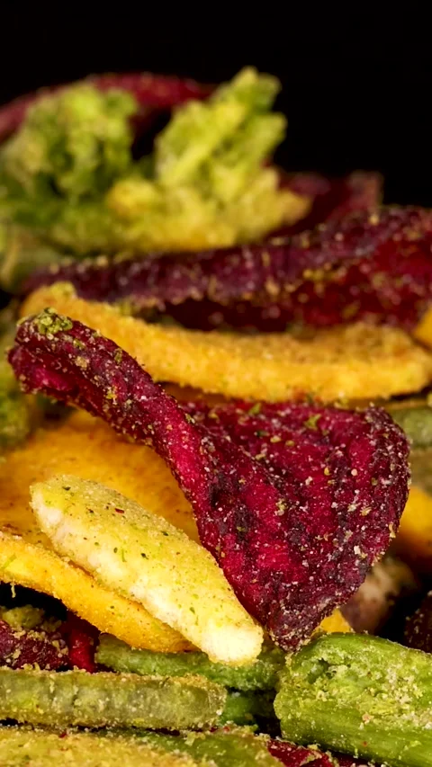 Vertical  of Rotating Colorful Mixed Vegetable and Root Chips Stock Footage 327831840