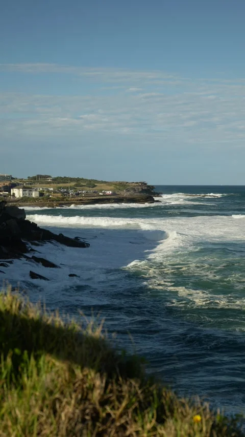 Vertical rough seas around Coogee cliffs in Sydney 6K Stock Footage 305726317