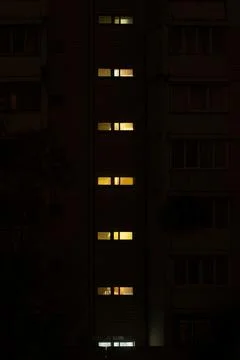 A vertical row of narrow rectangular windows Stock Photos