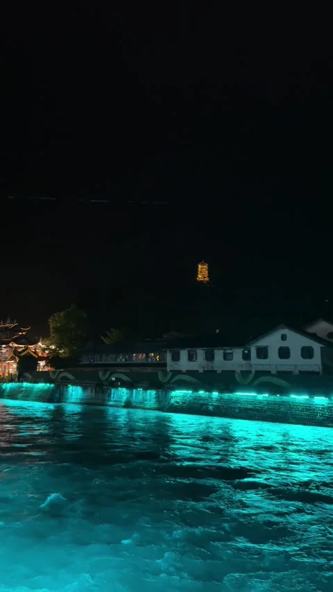 Vertical Rushing River Below Illuminated Ancient Bridge Stock Footage 334827254
