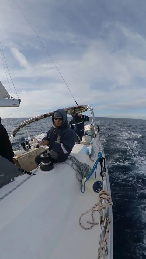 Vertical, Sailboat run over the winter sea,cloudy with sun, 360 effect, side Stock Footage 120745214