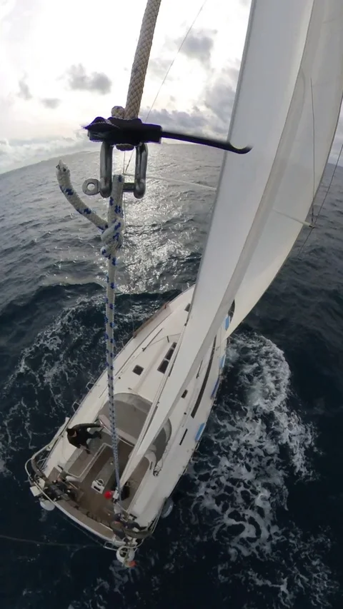 Vertical, Sailboat run over the winter sea,cloudy with sun, 360 effect, above Stock Footage 120745284