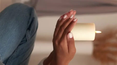 Vertical saint's day candle praying woman hands Stock Footage 255546930