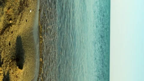 Vertical Sand Beach And Blurred With Bokeh Background Of Sea Wave Stock Footage 252632892