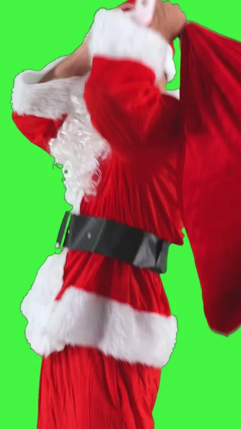 Vertical Santa Claus take the sack of gifts from the floor and heading out .. Stock Footage 285348267