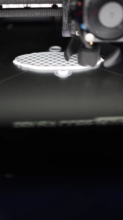 Vertical screen 3D printer head moves with precision while building white mesh b Stock Footage 311130338