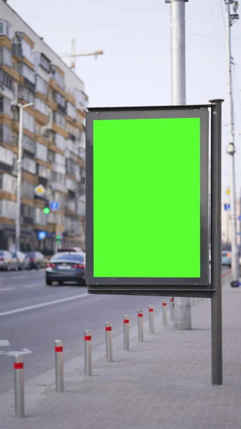 Vertical Screen: Advertising green screen billboard with city traffic background Video stock 236620916