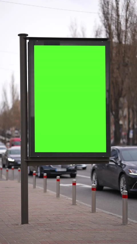 Vertical Screen: Advertising green screen billboard with city traffic background Video stock 237313276