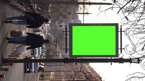 Vertical Screen: Advertising green screen billboard with city traffic background Video stock 240079680