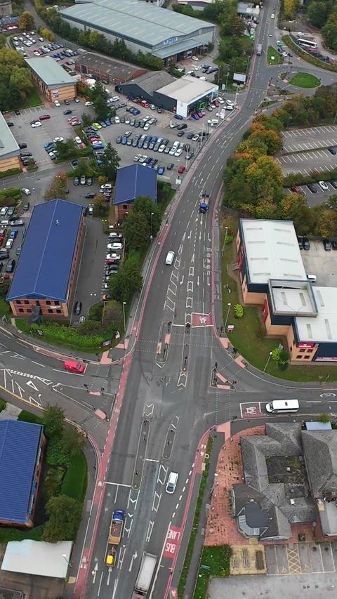 Vertical screen Aerial Intersection Over Business Park Leeds, Complex Stock Footage 330834759