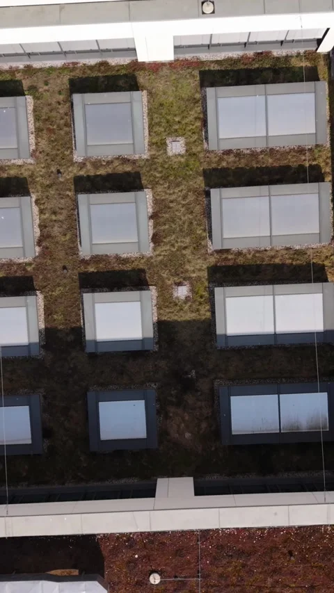 Vertical screen Aerial Modular Rooftop Showing Planted Cells, Skylight Array Stock Footage 334664177
