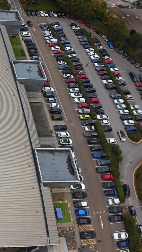 Vertical screen Aerial View Of Busy Campus Parking Leeds, Long Linear Bays Stock Footage 330835304