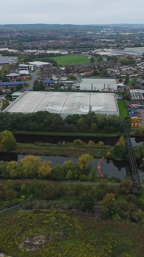 Vertical screen Aerial View Of Leeds Industrial Canal, Overcast Autumn Day With Stock Footage 335328178