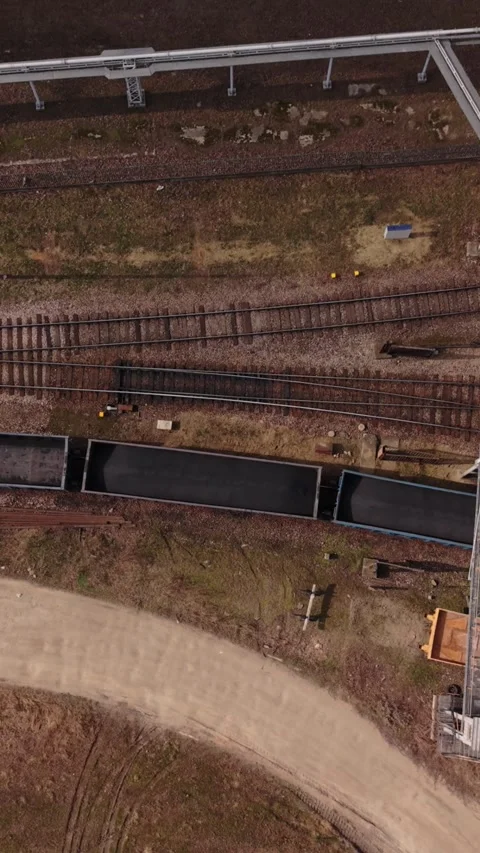 Vertical screen Aerial View Rail Siding Warsaw With Empty Gondola Wagons Stock Footage 334664388