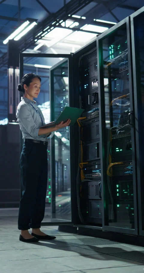 Vertical Screen Asian Female Data Center Engineer Using Laptop Comp Stock Footage 320001430
