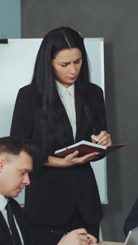 Vertical screen: Assistant Taking Notes During Business Meeting Stock Footage 280679529