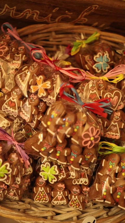 Vertical screen basket full of decorated gingerbread cookies packed in plastic b Stock Footage 318869391