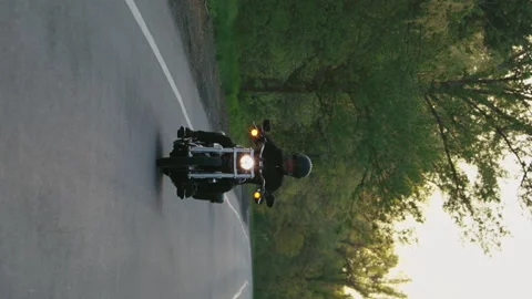 Vertical Screen: Biker riding motorcycle in slow motion Stock Footage 167821812