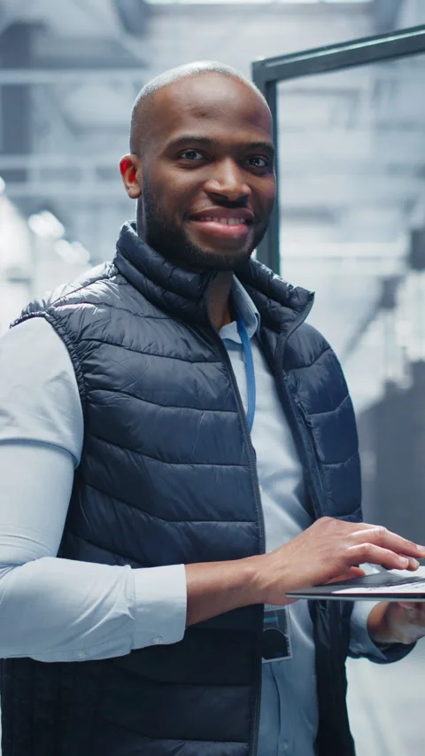 Vertical Screen Black Data Center Engineer Using Laptop Computer Stock Footage 320867762