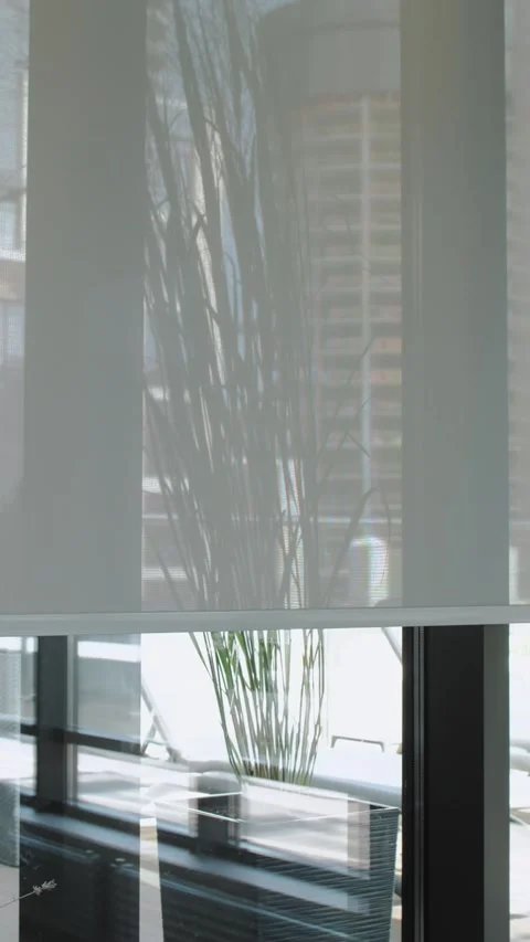Vertical Screen: Blinds on the window that open create a pattern of light and Stock Footage 273493364