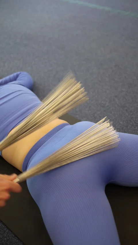 Vertical screen body tapping session using flexible metal rods — rhythmic moveme Stock Footage 306596714