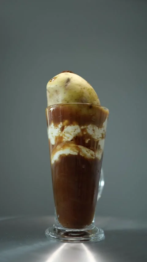 Vertical screen: A bold macchiato with real potato and whipped cream, symbolizin Stock Footage 300021455