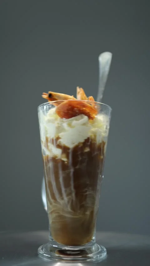 Vertical screen: A bold ristretto with whipped cream and grilled shrimp, creatin Stock Footage 300021365