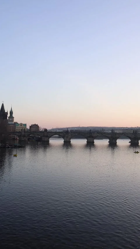 Vertical screen: A breathtaking view of the historic Charles Bridge at sunset, s Stock Footage 303907599