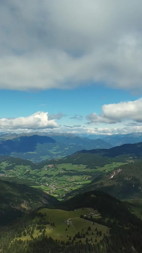 Vertical Screen Breathtaking View Of Towering Mountains And Sprawling Farmland Stock Footage 325825414
