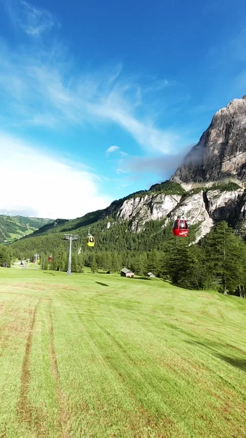 Vertical screen bright summer landscape with teleferics, colorful cable cars Stockbeeldmateriaal 323099831