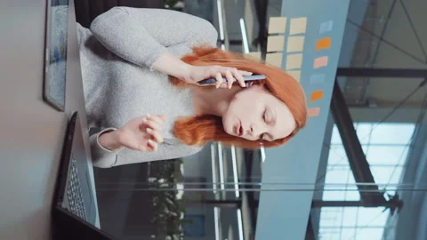 Vertical Screen: Business advisor giving consultation on phone Stock Footage 223755656