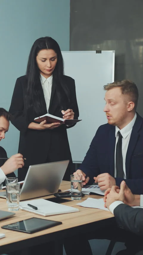 Vertical Screen: Business Team Engaged in Serious Meeting Stock Footage 282579997