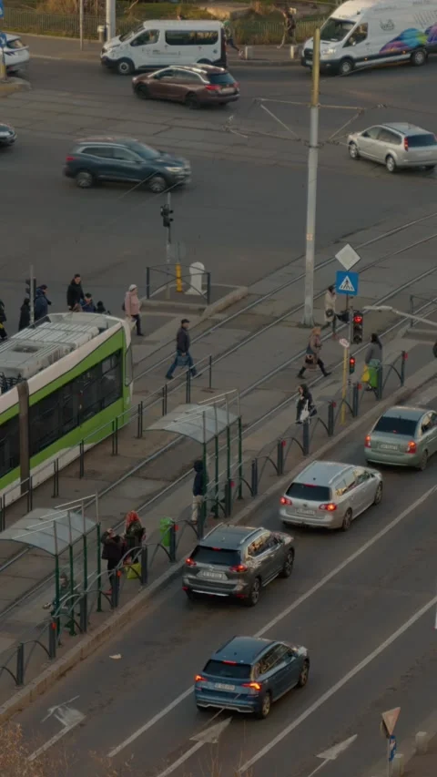 Vertical Screen Busy evening intersection with traffic jams and pedestrians Stock Footage 303505246