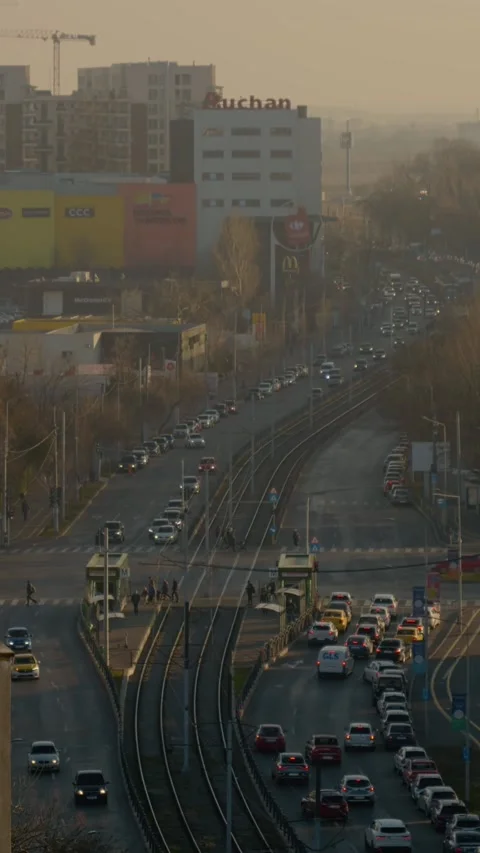 Vertical Screen Busy street intersection during evening rush hour Stock Footage 303505249