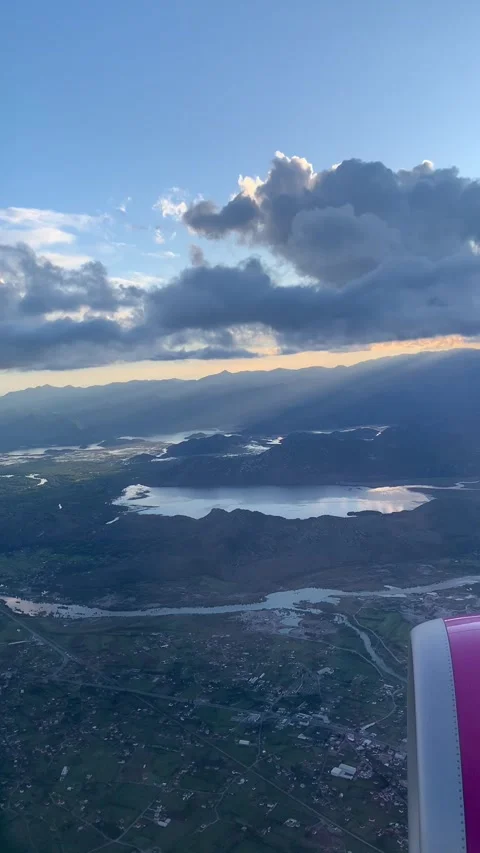 Vertical screen: A captivating aerial view of a serene landscape with winding ri Stock Footage 296284186