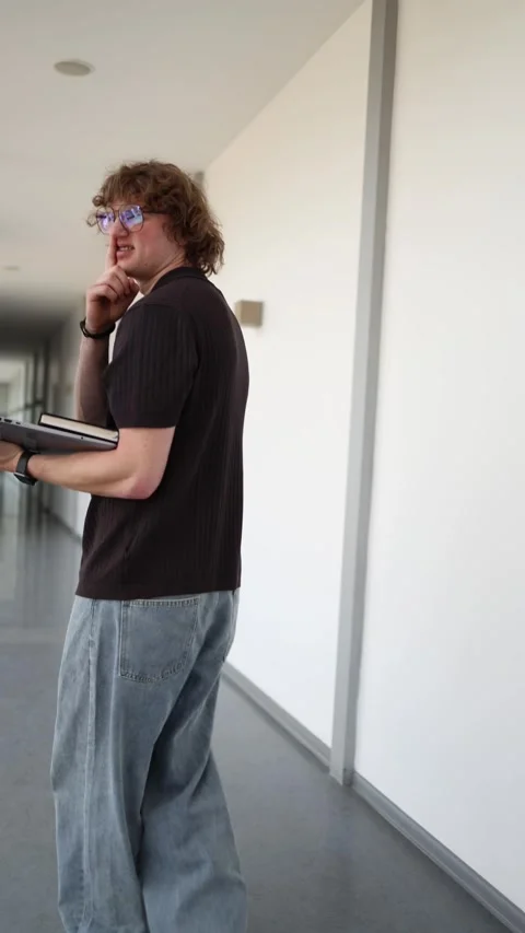 Vertical screen Careless software developer walks away scratching himself while  Stock Footage 337849813