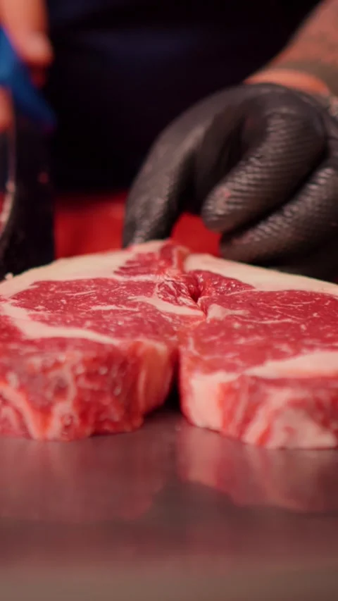 Vertical Screen Chef hands making a heart shape form raw fresh beef meat Stock Footage 299954200