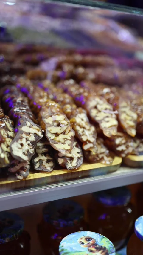 Vertical screen churchkhela walnut sweets Stock Footage 331199666