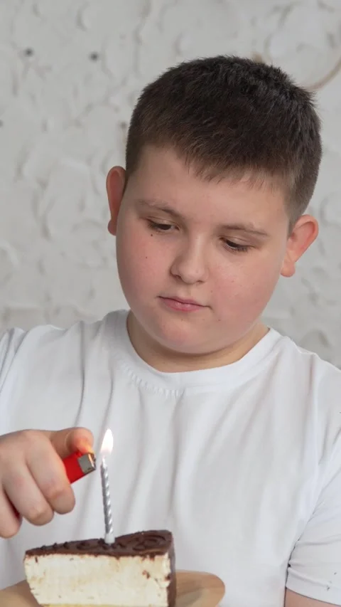 Vertical screen: Close-up of charming caucasian little boy making wish and Stock Footage 263236656