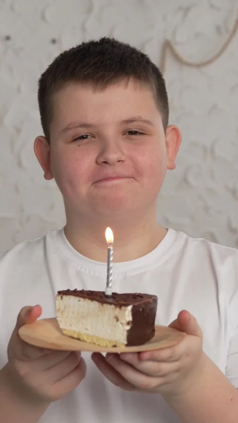Vertical screen: Close-up of charming caucasian little boy making wish and Stock Footage 263439580
