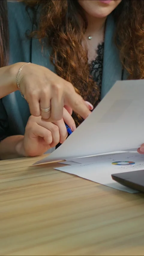 Vertical Screen Close up female hands women in office doing paperwork. Stock Footage 299984597