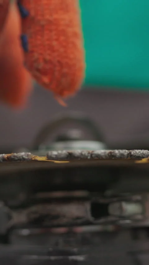 Vertical Screen: Close up of grinder or polishers in hands. The man is preparing Stock Footage 272173269