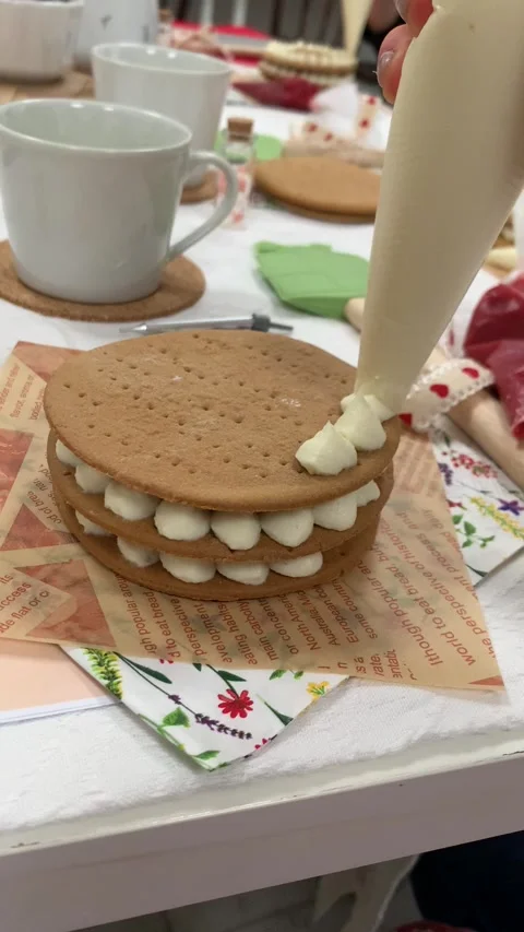 Vertical screen: Close-up of a homemade dessert being decorated with cream, feat Stock Footage 296532632