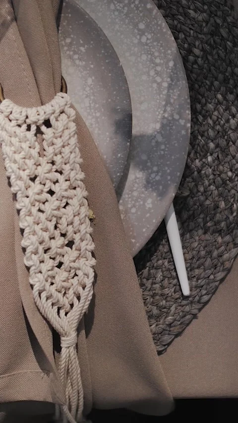 Vertical screen: Close up. plates with woven napkin outdoors. wedding table Video stock 308627555