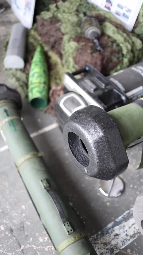 Vertical screen close-up of portable anti-tank weapon systems on concrete floor  Stock Footage 311149712
