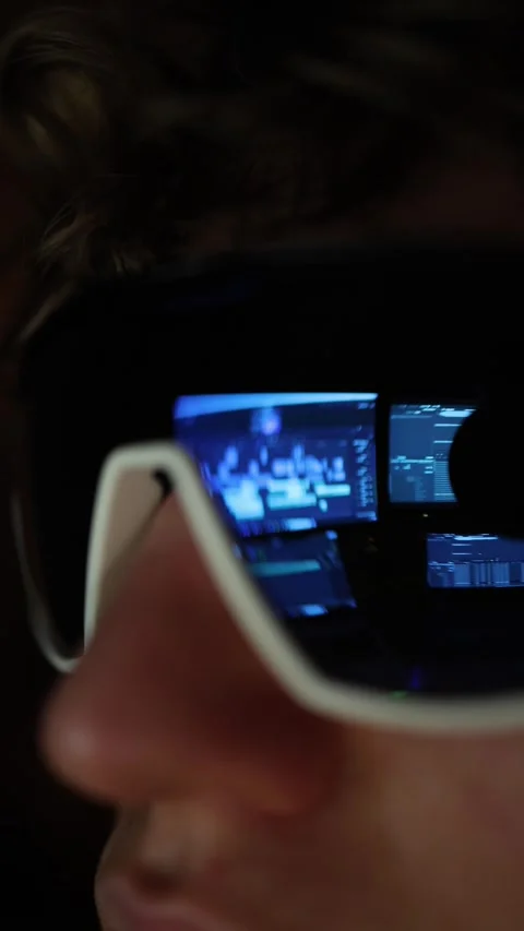 Vertical screen A close-up reflection in futuristic sunglasses reveals multiple  Stock Footage 297111071