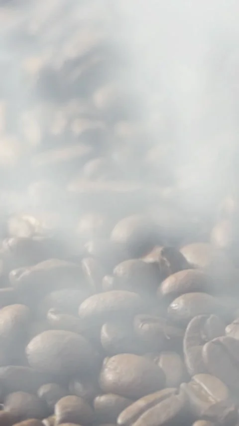 Vertical Screen: Close-up of roasted coffee beans. Aromatic coffee beans are Stock Footage 229974837
